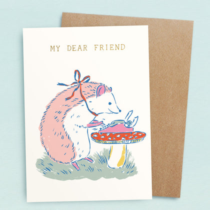 A pile of several brightly colored greetings cards on a  light blue background with small gold stars and flowered postage stamps. 