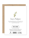 Back of the Snowdrops Luxe Sympathy Card by Biely & Shoaf, with a gold foil snowdrop illustration, Louise Mulgrew’s signature, design origin text, and eco-friendly certification logos.