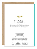 The back of the Homespun Bouquet Birthday Card by Biely & Shoaf features "illustrated by Carrie Shryock" with a yellow flower above, plus an artist bio and brand logo below, all on FSC-certified recycled paper.