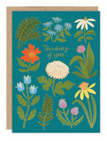The Botanical Sympathy Card by Biely & Shoaf features Carrie Shryock’s illustration of colorful flowers and green leaves on teal, with gold "Thinking of you..." text. Includes a brown recycled paper envelope.