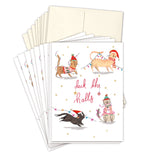 A set of Cats Deck The Halls Boxed Holiday Cards by Biely & Shoaf, featuring four cats in winter hats and scarves with string lights and “Deck the halls” in red script, all printed on recycled paper.