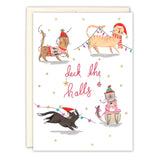 The Cats Deck The Halls Boxed Holiday Cards by Biely & Shoaf feature four festive cats in hats and sweaters playing with string lights, "Deck the halls" in red script, gold accents, and are printed on recycled paper.