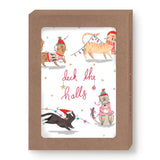Cats Deck The Halls Boxed Holiday Cards by Biely & Shoaf feature four playful cats in winter accessories tangled in holiday lights and garlands, with “deck the halls” in red script—all framed by a brown box. Printed on recycled paper.