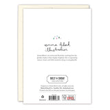 The back of the Dogs Making Spirits Bright Boxed Holiday Cards by Biely & Shoaf shows an Emma Block illustration with small colorful hearts, a brief artist bio, gold foil Biely & Shoaf logo, FSC mark, copyright, barcode, and recycling info.