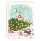 The Biely & Shoaf Cats Christmas Mischief Boxed Holiday Cards feature two hat-wearing cats atop a festive tree, ornaments and presents below, a playful black cat, and "Seasons Greetings" in gold foil. Printed on recycled paper.