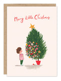 Child in stripes decorates tree; Merry Little Christmas—ideal for Biely & Shoaf’s holiday card set.