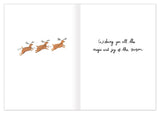 Three reindeer dash left; right side reads “Merry Christmas” on this Biely & Shoaf Santa In Flight holiday card.