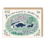 Skunks Stinkin' Cute New Baby Card by Biely & Shoaf—two skunks with flowers and grass on recycled paper.