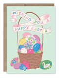 The Vintage Easter Basket Easter Card by Biely & Shoaf features a basket of decorated eggs, floral patterns, and a swan with a ribbon banner that reads "Wishing You A Happy Easter" on a light green background. Printed in the USA.