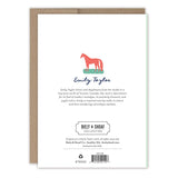 The back of the Vintage Easter Basket Easter Card features a red horse illustration above Emily Taylor in blue script, a brief artist bio, Biely & Shoaf logo and copyright info. Printed in the USA. A brown envelope appears behind the card.