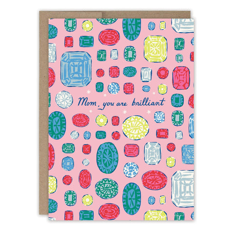 The Gems Mother's Day Card by Biely & Shoaf features colorful gemstones on a pink background with "Mom, you are brilliant" in blue cursive. It includes a brown envelope—perfect for celebrating Mom.