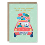 The Penguin & Polar Bear Boxed Holiday Cards (Set of 10) by Biely & Shoaf feature a polar bear and bird driving a red car with gifts, plus Its the most wonderful time of the year text—printed on FSC-certified paper.
