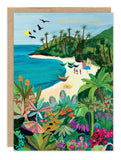The Beach Butterfly Birthday Card by Biely & Shoaf is an A6 recycled card featuring a vibrant tropical beach scene with palm trees, boats, people, and black birds, accented with gold-foiled "Birthday Wishes" at the top.