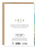 The back of the Beach Butterfly Birthday Card by Biely & Shoaf features Hebe Studio’s logo, a brief description, collection branding, and a plain background with a brown envelope partially visible behind it.