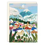 The All Is Calm Snowy Village Boxed Holiday Cards by Biely & Shoaf feature a winter village with colorful houses, snowy trees, blue sky, white moon, and “ALL IS CALM, ALL IS BRIGHT” in gold foil—perfect for Christmas cards.