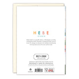 The back of the All Is Calm Snowy Village Boxed Holiday Cards (set of 10) by Biely & Shoaf features the logo, designer bio, copyright info, recycled paper note, gold foil publisher and paper certification logos.