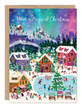 Aurora Magical Christmas Holiday Card by Biely & Shoaf; snowy village, skaters, and festive cheer!.