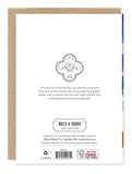 Back of Biely & Shoaf's Aurora Magical Christmas card, with company info, recycle icons, and brown envelope peeking out.