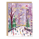The Winter Park Scene Holiday Card by Biely & Shoaf features people ice skating in a snowy park.