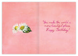 The Bloom & Grow Birthday Card by Biely & Shoaf features pink polka dots, three white daisies with green leaves, and the message You make the world a more beautiful place. Happy Birthday! printed on FSC-certified recycled paper.