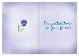 The All The Joy Wedding Card by Biely & Shoaf features a watercolor purple flower and “Congratulations on your forever” in blue script on a lavender background. Printed on FSC-certified recycled paper.