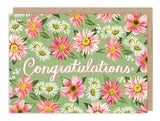 The Country Blooms Congrats Card by Biely & Shoaf features pink, white, and yellow flowers on a green background with "Congratulations" in elegant white script and gold foil accents. Comes with a matching brown envelope.