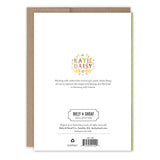 The back of the Clover Heart St. Patrick's Day Card displays Biely & Shoaf branding, a floral Katie Daisy credit, artist bio, barcode, copyright info, printed in the USA note, and comes with a brown kraft envelope.