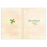 The Clover Heart St. Patrick's Day Card by Biely & Shoaf features a green four-leaf clover on the left and "Love and Luck to you!!" in green script on a light grid-patterned background, printed in the USA.