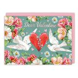 The Love Birds Valentine's Day Card by Biely & Shoaf features two white doves, a red heart with blue flowers, "Dear Valentine" text, and pretty blooms on teal. Includes a pink envelope. Beautifully printed in the USA.
