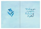 Blue menorah on left, text on right: Happy Hanukkah! A Biely & Shoaf Menorah card printed on recycled paper.