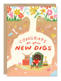 The New Digs New Home Card by Biely & Shoaf features a whimsical mole reading in an armchair underground, with bones, jewels, and flowers on the tunnel walls. The card reads: "Congrats on your new digs”—perfect for new homeowners.
