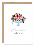 The Biely & Shoaf Beautiful Bride To Be Bridal Shower Card features a watercolor design of pink and red flowers in a glass vase with the handwritten message “for the beautiful bride to be” on a white background.