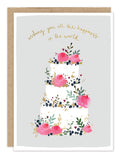Biely & Shoaf Wedding Cake Card: white 3-tier cake with pink flowers, gold foil “happiness” on recycled paper.