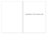 A Biely & Shoaf "Wedding Cake" card on recycled paper, open to handwritten: Congratulations to the beautiful couple!.