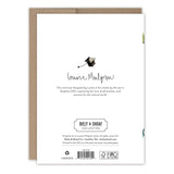 Back of a Frogs Graduation Card by Biely & Shoaf, featuring a frog illustration and design inspiration text. Printed on recycled paper with brand logos, copyright, and company details. Card is shown resting on a brown envelope.