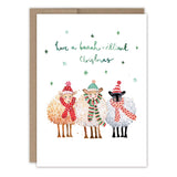 The Biely & Shoaf Baaah-rilliant Christmas Sheep Holiday Card features three smiling sheep in winter hats and scarves under the phrase Have a baaah-rilliant Christmas, with snowflakes, printed on FSC-certified recycled paper.