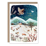 Owl Winter Countryside Boxed Holiday Cards by Biely & Shoaf feature a snowy landscape with trees, deer, fox, birds, and an owl flying over a cottage. Winter wishes shimmers in gold foil. Set of 10 cards printed on FSC-certified paper.