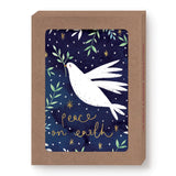 Biely & Shoaf’s Dove Peace On Earth Boxed Holiday Cards feature a white dove with an olive branch on a starry night sky, gold foil “peace on earth” script, and come in a brown box. Printed on recycled paper.