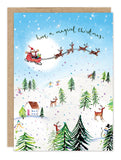Santa and reindeer soar above snow on Biely & Shoaf's Santa Magical Christmas Holiday Card Set.