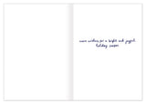An open Biely & Shoaf Polar Bear & Bird Merry Christmas card with handwritten holiday wishes on the right page.