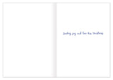 Open Biely & Shoaf Noel Holiday Card to reveal "Sending joy and love this Christmas" handwritten on the right page.