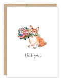 Corgi Dog Thank You Card by Biely & Shoaf features a corgi with a colorful bouquet in its mouth and "thank you" in cursive below on a white card, blank inside, with a brown envelope included.