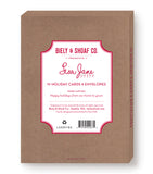 A set of 10 Biely & Shoaf Palm Tree Warm Wishes Holiday Cards with envelopes, featuring a festive message. Made from FSC-certified recycled paper and sold in a branded box.