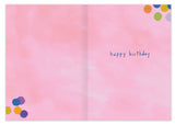 The All Your Wishes Birthday Card by Biely & Shoaf features a soft pink background, colorful polka dots in the corners, and "happy birthday" in blue lowercase letters on the right, printed on recycled paper for an eco-friendly touch.