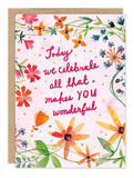 The All That Makes You Wonderful Birthday Card by Biely & Shoaf features watercolor flowers and leaves, gold foil details, and a light pink background framing the message: Today we celebrate all that makes YOU wonderful.