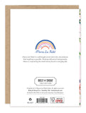 The back of the All That Makes You Wonderful Birthday Card by Biely & Shoaf displays a rainbow illustration, artist bio, brand logo, gold foil details, recycling symbol, and barcode.