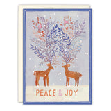 The Peace & Joy Reindeer Holiday Card by Biely & Shoaf features two deer with vibrant antler branches, surrounded by snow, plants, and snowflakes. Gold foil text at the bottom reads PEACE & JOY in pink and orange—ideal for the holiday season.