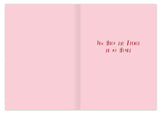 The Love Tickets Anniversary Card by Biely & Shoaf features a pink ticket design with red text on the right: "You hold the ticket to my heart." Illustrated by Sarah Long, the left side is blank for your message.