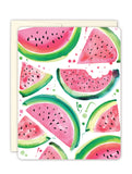 The Watermelon Slices Boxed Cards by Biely & Shoaf feature a vibrant watercolor pattern with watermelon slices of various shapes and sizes, highlighted by pink, green, and black seeds set against a white backdrop. Crafted from recycled paper, these cards are an eye-catching addition to any notecard collection.