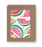 The Watermelon Slices Boxed Cards by Biely & Shoaf feature a vibrant illustration of watermelon slices on a white background, highlighting shades of pink, red, and green. The artwork is enclosed in a brown cardboard frame crafted from recycled paper, giving it the appearance of an illustrated notecard or decorative poster.